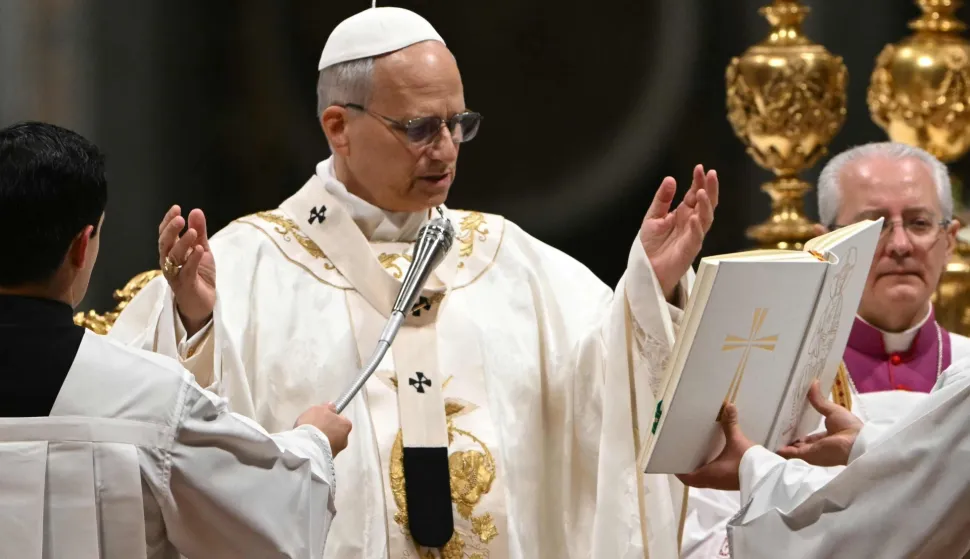 Pope Leo XIV presides over the Easter vigil as part of the Holy Week celebrations, at St Peter's basilica in the Vatican on April 4, 2026. (Photo by Andreas SOLARO/AFP)