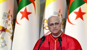 TOPSHOT - Pope Leo XIV addresses authorities, members of the civil society and the diplomatic corps at the ?Djamaa el Djazair? Conference Center on April 13, 2026. Pope Leo XIV embarks today on an 11-day visit to Algeria, Cameroon, Angola and Equatorial Guinea for his first major international trip since becoming pontiff last year. (Photo by Alberto PIZZOLI/AFP)