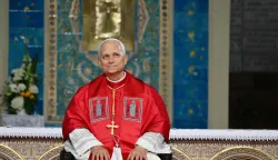 Pope Leo XIV listens to cardinal Jean-Paul Vesco during a meeting with the Algerian community in the Basilica of Our Lady of Africa, in Algiers on April 13, 2026. Pope Leo XIV embarks today on an 11-day visit to Algeria, Cameroon, Angola and Equatorial Guinea for his first major international trip since becoming pontiff last year. (Photo by Alberto PIZZOLI/AFP)