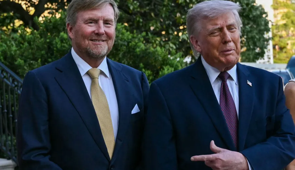 King of the Netherlands Willem-Alexander (L) is welcomed by US President Donald Trump into the White House in Washington, DC, on April 13, 2026. (Photo by Brendan SMIALOWSKI/AFP)