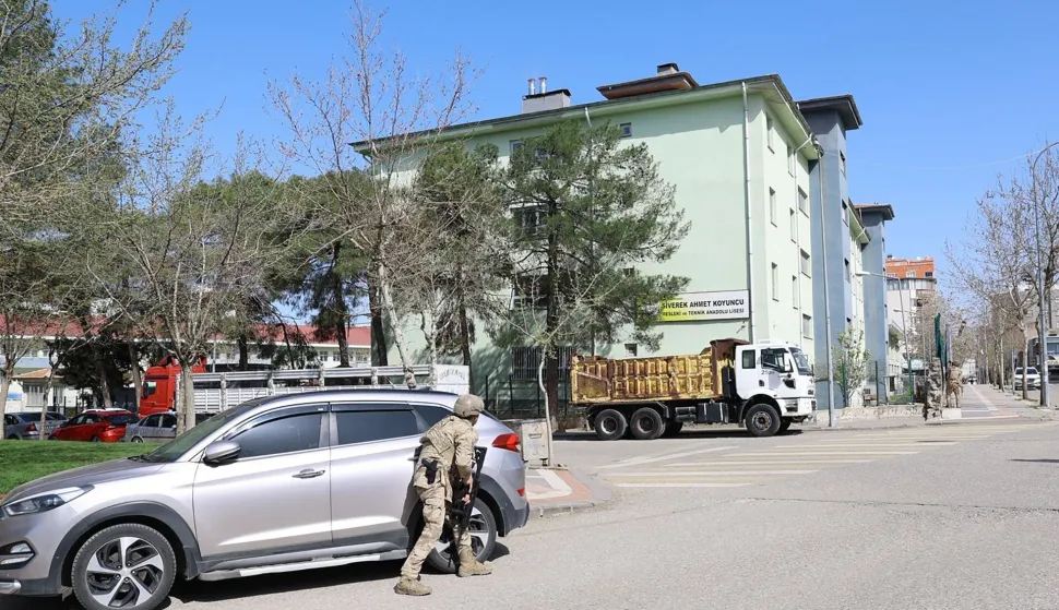 This handout photograph taken and released on April 14, 2026 by Turkish news agency DHA (Demiroren News Agency) shows special force security surrounding the school as students are evacuated in southeastern Turkey. An ex-student opened fire at his former high school on April 14, 2026 in Turkey, wounding 16 people including students before killing himself in a showdown with police, officials said. Special security forces were deployed to the school in the southeastern province of Sanliurfa, where students were evacuated, the local governor, Hasan Sildak, told reporters. (Photo by Handout/DHA (Demiroren News Agency)/AFP)/Turkey OUT/RESTRICTED TO EDITORIAL USE - MANDATORY CREDIT "AFP PHOTO/DHA (Demiroren News Agency) " - NO MARKETING NO ADVERTISING CAMPAIGNS - DISTRIBUTED AS A SERVICE TO CLIENTS