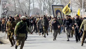 TOPSHOT - Shia Muslim demonstrators hold a portrait of Iran's late supreme leader Ayatollah Ali Khamenei in Srinagar on March 2, 2026 as restrictions were imposed amid protests over his death by US-Israel strikes. (Photo by Habib NAQASH/AFP)