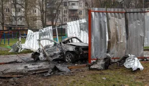 This photograph taken on April 3, 2026 shows a destroyed car in the courtyard of a residential building following an air attack in Vyshneve, Kyiv region, amid the Russian invasion of Ukraine. Ukraine on April 3, 2026 faced nearly 500 Russian missile and drone attacks that killed at least six people, officials said, the latest in an increasing number of daytime strikes by Moscow. (Photo by Serhii Okunev/AFP)