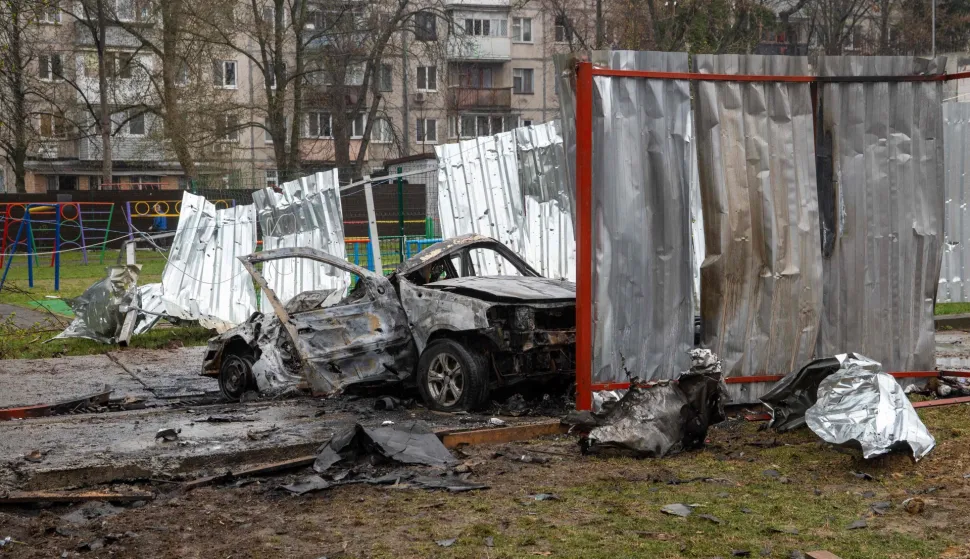This photograph taken on April 3, 2026 shows a destroyed car in the courtyard of a residential building following an air attack in Vyshneve, Kyiv region, amid the Russian invasion of Ukraine. Ukraine on April 3, 2026 faced nearly 500 Russian missile and drone attacks that killed at least six people, officials said, the latest in an increasing number of daytime strikes by Moscow. (Photo by Serhii Okunev/AFP)