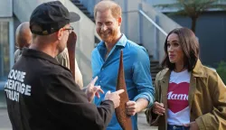 Britain's Prince Harry, Duke of Sussex, and his wife Meghan, the Duchess of Sussex, are shown indigenous items by representatives from the Koorie Heritage Trust at the Scar Tree Walk in Melbourne on April 16, 2026. (Photo by Jonathan Brady/POOL/AFP)