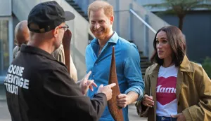 Britain's Prince Harry, Duke of Sussex, and his wife Meghan, the Duchess of Sussex, are shown indigenous items by representatives from the Koorie Heritage Trust at the Scar Tree Walk in Melbourne on April 16, 2026. (Photo by Jonathan Brady/POOL/AFP)