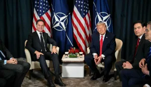 TOPSHOT - US President Donald Trump (C-R) speaks with NATO?s Secretary-General Mark Rutte (L) next to US Secretary of State Marco Rubio (2R) during a bilateral meeting on the sidelines of the World Economic Forum (WEF) annual meeting in Davos on January 21, 2026. The World Economic Forum takes place in Davos from January 19 to January 23, 2026. (Photo by Mandel NGAN/AFP)