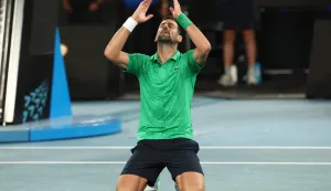 Serbia's Novak Djokovic celebrates victory over Italy's Jannik Sinner after their men's singles semi-final match on day thirteen of the Australian Open tennis tournament in Melbourne on January 31, 2026. (Photo by IZHAR KHAN/AFP)/-- IMAGE RESTRICTED TO EDITORIAL USE - STRICTLY NO COMMERCIAL USE --