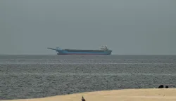 A ship is seen in the Persian Gulf off the coast of Sharjah the day after the failure of US-Iran peace talks on April 13, 2026. The failure of US-Iran peace talks has left the US President with several unpalatable options, as analysts say his order to blockade the strategic Strait of Hormuz could further complicate his next move on April 12, 2026. Any hopes that US Vice President would emerge from the marathon day of negotiations with top Iranian officials with a deal to end a war that has rippled across the Middle East were dashed when he left hosts Pakistan emptyhanded. (Photo by AFP)