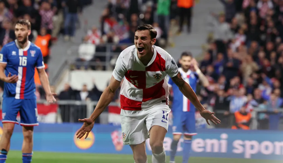 Rijeka, 14.11.2025 - Utakmica kvalifikacija za nogometno SP 2026. Hrvatska - Farski otoci na stadionu Rujevica u Rijeci. Na slici Petar Musa slavi postignuti pogodak. foto HINA/ Damir SEN?AR/ ds