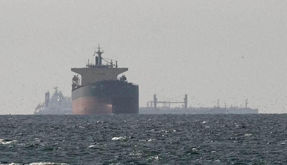 FILE PHOTO: Cargo ships in the Gulf, near the Strait of Hormuz, as seen from northern Ras al-Khaimah, near the border with Oman's Musandam governance, amid the U.S.-Israeli conflict with Iran, in United Arab Emirates, March 11, 2026. REUTERS/Stringer/File Photo Photo: STRINGER/REUTERS