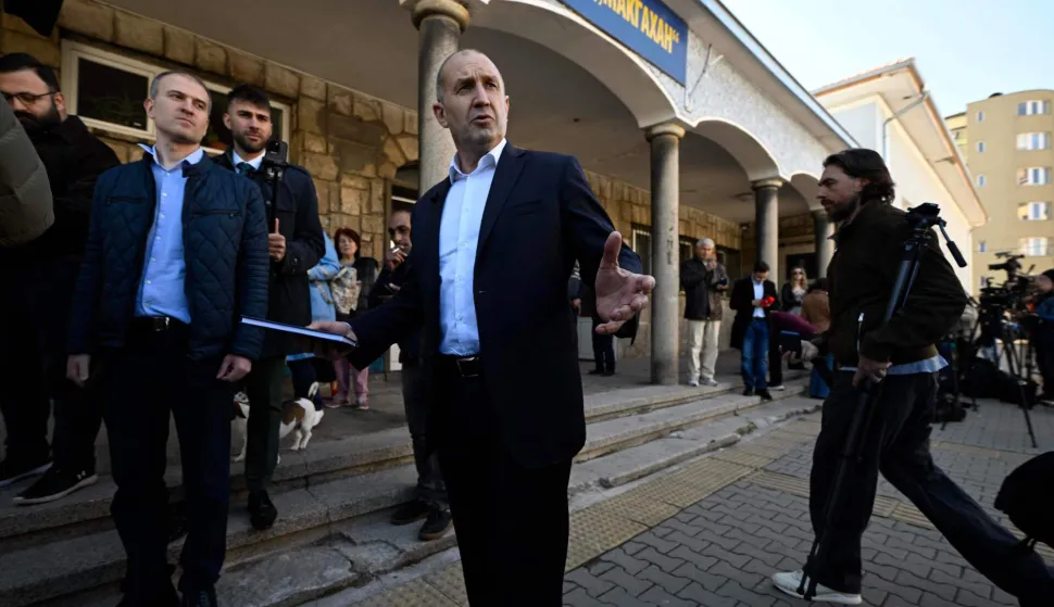 Progressive Bulgaria coalition's leader and former President Radev Rumen (C) addresses media after casting at a polling station during Bulgaria's parliamentary elections in Sofia on April 19, 2026. Bulgarians vote in the country's eighth election in five years today, with ex-president Rumen Radev's grouping tipped to win on a pledge to fight corruption, after an anti-graft movement triggered a long political crisis. (Photo by Dimitar KYOSEMARLIEV and Dimitar KYOSEMARLIEV/AFP)