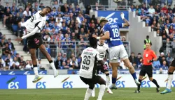 TOPSHOT - Rennes' Moroccan defender #48 Abdelhamid Ait Boudlal (L) goes for a header during the French L1 football match between RC Strasbourg Alsace and Stade Rennais FC at the Stade de la Meinau in Strasbourg, eastern France, on April 19, 2026. (Photo by ROMEO BOETZLE/AFP)