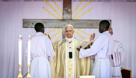 Pope Leo XIV (C) leads the Holy Mass at the Saurimo esplanade in Saurimo on the eighth day of an 11-day apostolic journey to Africa, on April 20, 2026. (Photo by Alberto PIZZOLI/AFP)