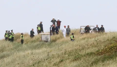 epa06890320 US President Donald J. Trump (3-R) after playing a shot during a round of golf at Trump Turnberry golf resort in Turnberry, Scotland, 15 July 2018. Trump is on a three-day working visit to the United Kingdom, his first trip to the country as US president. EPA/ROBERT PERRY BEST QUALITY AVAILABLE