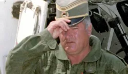 epa06342070 (FILE) - The Commander of Bosnian Serb army General Ratko Mladic adjusts his cap, as he arrives at the UN headquarters in the airport of Sarajevo, Bosnia and Herzegovina, 06 August 1993 (reissued 21 November 2017). The United Nations International Criminal Tribunal for the former Yugoslavia (ICTY) will on 22 November 2017 announce the verdict on Mladic in The Hague, the Netherlands. Mladic, who was Commander of the Bosnian Serb Army (VRS) Main Staff from May 1992 until at least November 1996, is indicted with counts of genocide, crimes against humanity, and violations of the laws or customs of war. EPA/STRINGER BEST QUALITY AVAILABLE