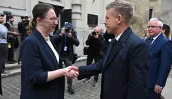 Hungary's Prime minister-elect Peter Magyar (R) is welcomed by Israel's ambassador to Hungary Maya Kadosh (L) as he arrives to attend a commemoration ceremony to mark the 82th anniversary of Hungarian Holocaust victims at the Holocaust Memorial Center in Budapest, Hungary on April 16, 2026. April 16, 2026 marks the 82th anniversary of the beginning of the Hungarian Holocaust during which some 600,000 Jewish Hungarians were deported to Nazi death camps in Austria, Germany and Poland. The Memorial Day of the Hungarian Victims of the Holocaust was established by the Ministry of Education in 2000 and is commemorated in schools, at memorial sites and by Jewish communities throughout the country. (Photo by Attila KISBENEDEK/AFP)