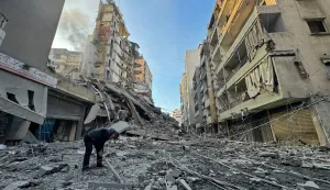 A man inspects the debris of destroyed buildings at the site of an Israeli airstrike that targeted Haret Hreik neighbourhood in Beirut's southern suburbs, on March 7, 2026. Lebanese official media reported on March 7 that clashes had erupted as Israeli forces attempted a landing operation along the Lebanon-Syria border, with militant group Hezbollah saying its fighters were involved. There was no immediate comment from the Israeli military, which has launched numerous strikes and sent ground troops into Lebanon since Tehran-backed group Hezbollah fired missiles at Israel on March 2 to avenge the killing of Iranian supreme leader Ali Khamenei. (Photo by AFP)