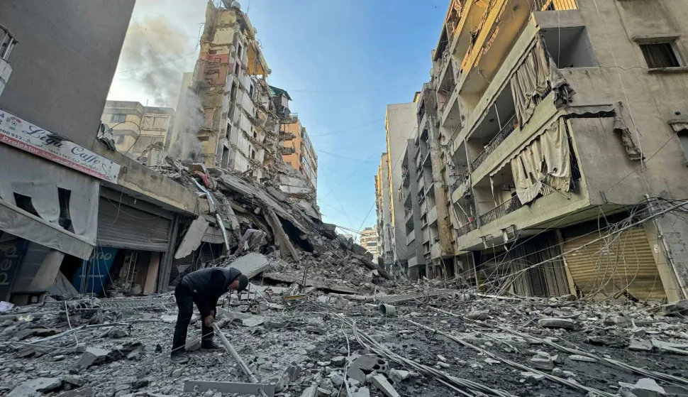 A man inspects the debris of destroyed buildings at the site of an Israeli airstrike that targeted Haret Hreik neighbourhood in Beirut's southern suburbs, on March 7, 2026. Lebanese official media reported on March 7 that clashes had erupted as Israeli forces attempted a landing operation along the Lebanon-Syria border, with militant group Hezbollah saying its fighters were involved. There was no immediate comment from the Israeli military, which has launched numerous strikes and sent ground troops into Lebanon since Tehran-backed group Hezbollah fired missiles at Israel on March 2 to avenge the killing of Iranian supreme leader Ali Khamenei. (Photo by AFP)