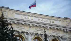 epa09791192 The Russian National flag waves atop the Bank of Russia headquarters in Moscow, Russia, 28 February 2022. The Bank of Russia decided to raise the key rate from 9.5 percent to 20 percent per annum starting 28 February. The Central Bank attributed this to a radical change in external conditions. The measure was taken in light of harsh sanctions imposed by the international community on Russia following its troops entering Ukraine on 24 February, and the subsequent collapse of the ruble. EPA/SERGEI ILNITSKY