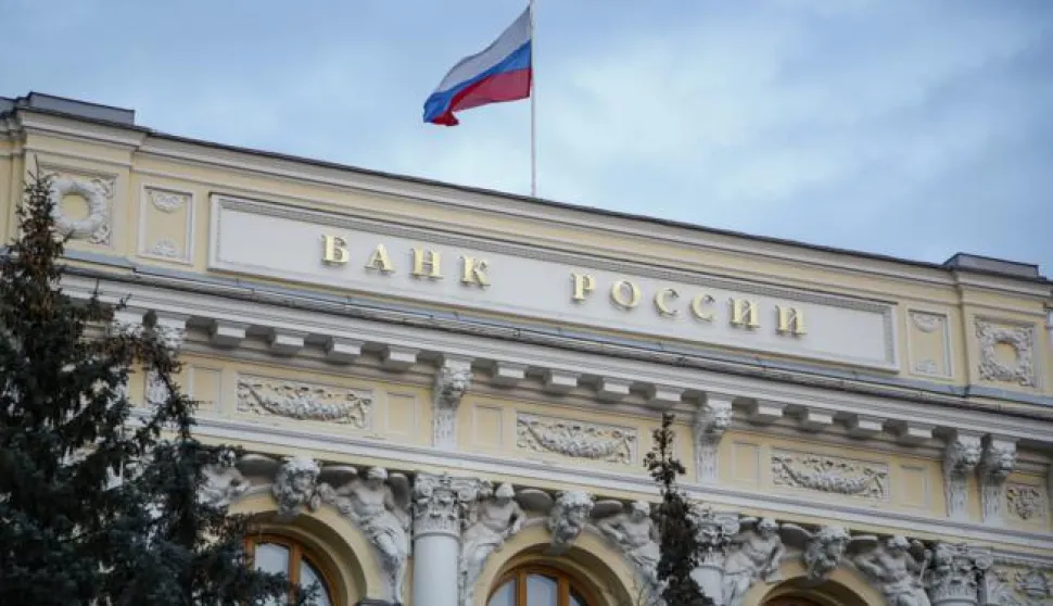 epa09791192 The Russian National flag waves atop the Bank of Russia headquarters in Moscow, Russia, 28 February 2022. The Bank of Russia decided to raise the key rate from 9.5 percent to 20 percent per annum starting 28 February. The Central Bank attributed this to a radical change in external conditions. The measure was taken in light of harsh sanctions imposed by the international community on Russia following its troops entering Ukraine on 24 February, and the subsequent collapse of the ruble. EPA/SERGEI ILNITSKY