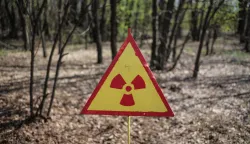 UKRAINE-CHERNOBYL-NUCLEAR-30TH ANNIVERSARY(160424) -- CHERNOBYL, April 24, 2016 (Xinhua) -- Photo taken on April 19, 2016 shows a warning sign in the forest near Chernobyl, Ukraine. Chernobyl, a place replete with horrific memories in northern Ukraine, close to Belarus, is now open to tourists, almost 30 years to the date after a nuclear power plant there exploded. It was the worst nuclear accident in human history. A large tract of land around the plant was designated a forbidden zone and ordinary people were completely prohibited from entering after the disaster occurred on April 26, 1986. The accident released more than 8 tons of radioactive leaks, directly contaminated an area of over 60,000 square kilometers and exposed some 3.2 million people to dangerous levels of radiation. (Xinhua/Dai Tianfang)(zhf)Dai Tianfang Photo: XINHUA/PIXSELL