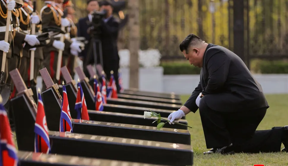 This picture taken on April 26, 2026 and released by North Korea's official Korean Central News Agency (KCNA) via KNS on April 27, 2026 shows North Korean leader Kim Jong Un (R) laying a flower at the tombstones of North Korean troops during the inauguration ceremony of the Memorial Museum of Combat Feats at the Overseas Military Operations in Pyongyang. (Photo by KCNA VIA KNS/AFP)/South Korea OUT/---EDITORS NOTE--- RESTRICTED TO EDITORIAL USE - MANDATORY CREDIT "AFP PHOTO/KCNA VIA KNS" - NO MARKETING NO ADVERTISING CAMPAIGNS - DISTRIBUTED AS A SERVICE TO CLIENTSTHIS PICTURE WAS MADE AVAILABLE BY A THIRD PARTY. AFP CAN NOT INDEPENDENTLY VERIFY THE AUTHENTICITY, LOCATION, DATE AND CONTENT OF THIS IMAGE./