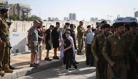 People and soldiers attend the funeral of Sergeant Idan Fooks, who was killed in combat in southern Lebanon, in Petah Tikva on April 27, 2026. The Israeli military said on April 26 that a soldier was killed in southern Lebanon, where a ceasefire has been in place since mid-April. Sergeant Idan Fooks, 19, died "during combat" in south Lebanon, while "an officer and three additional soldiers were severely injured, along with a soldier who was moderately injured and a soldier who was lightly injured", the military said. (Photo by Ilia YEFIMOVICH/AFP)/