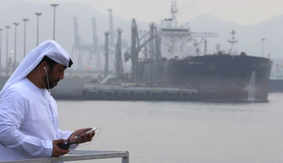 (FILES) An Emirati man stands at the oil terminal of Fujairah during the inauguration ceremony of a dock for supertankers on September 21, 2016. The United Arab Emirates will withdraw from the OPEC and OPEC+ oil cartels on May 1, 2026 state media said on April 28, 2026, calling it a strategic decision by the major producer. (Photo by Karim SAHIB/AFP)