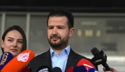 epa10555329 Montenegro's Presidential candidate Jakov Milatovic talks to media after casting his ballot during the second round of the Presidential elections in Podgorica, Montenegro, 02 April 2023. Some 540,000 eligible voters are casting their ballots to chose the next President of Montenegro. EPA/BORIS PEJOVIC