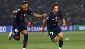 TOPSHOT - Paris Saint-Germain's Portuguese midfielder #87 Joao Neves (R) celebrates with Paris Saint-Germain's French midfielder #14 Desire Doue after scoring his team second goal during the UEFA Champions League semi-final first leg football match between Paris Saint-Germain (PSG) and Bayern Munich at the Parc des Princes in Paris on April 28, 2026. (Photo by FRANCK FIFE/AFP)