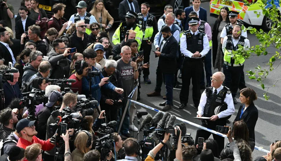 Metropolitan Police Commissioner Mark Rowley (2R) makes a statement to media from inside a Police cordon on Golders Green Road, in the Golders Green neighbourhood of north London, on April 29, 2026, after two people were stabbed, and a suspect arrested. The stabbing Wednesday of two Jewish men has been formally declared "a terrorist incident", London police said, with officers investigating "whether this attack was deliberately targeting the Jewish community". "Our highly specialised teams of officers are working... to progress this investigation quickly and establish exactly what has happened," said Assistant Commissioner Laurence Taylor, head of counter-terrorism policing. (Photo by JUSTIN TALLIS/AFP)