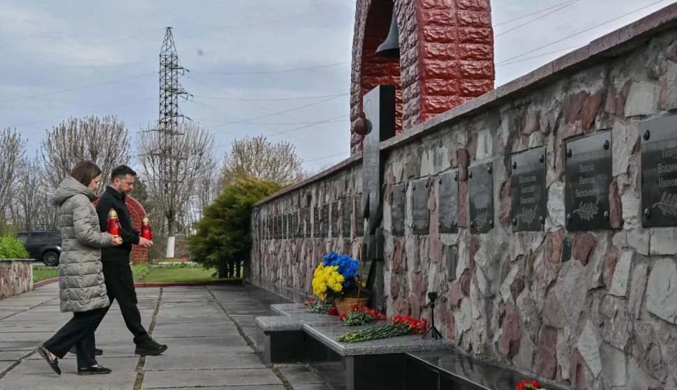Ukraine's President Volodymyr Zelensky (R) and President of Moldova Maia Sandu pay their respects at a memorial to commemorate the 40th anniversary of the Chernobyl nuclear disaster at the Chernobyl Power Plant on April 26, 2026, amid the Russian invasion of Ukraine. Ukraine on April 26, 2026, marked the 40th anniversary of the Chernobyl nuclear disaster amid deadly new drone attacks. It comes four years into the Russian invasion that has put the plant once again under threat and raised risks of another radioactive catastrophe. The 1986 explosion at Chernobyl was the worst civilian nuclear disaster in history and changed global perceptions of atomic energy. (Photo by Sergei SUPINSKY/AFP)