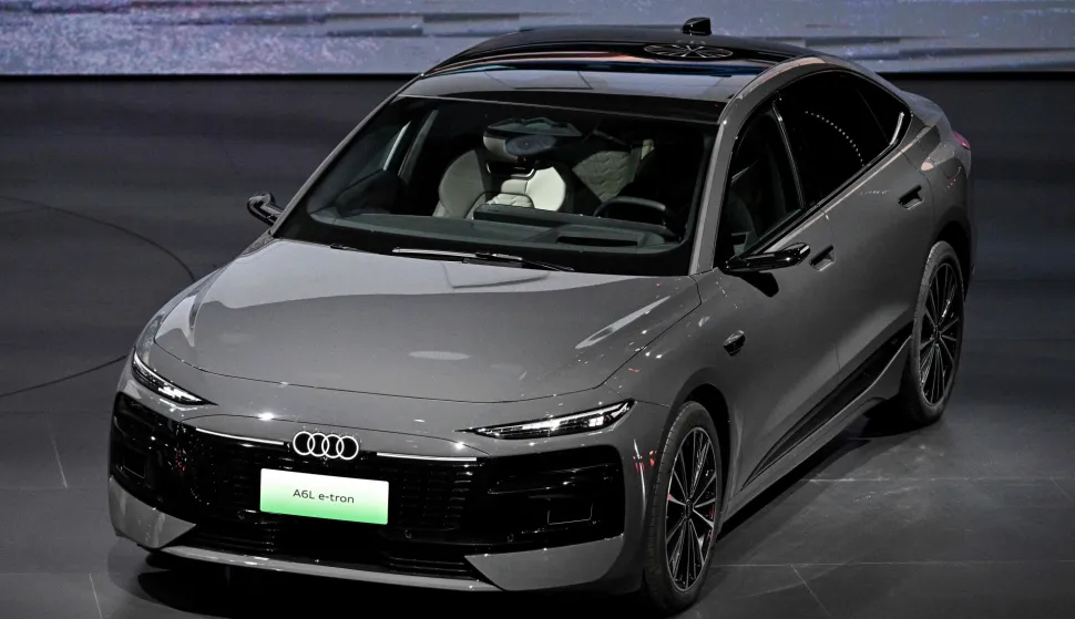 German carmaker AUDI's new AUDI A6L e-tron electric car model is presented at an event ahead of the Beijing Auto Show in Beijing on April 21, 2026. (Photo by Pedro PARDO/AFP)