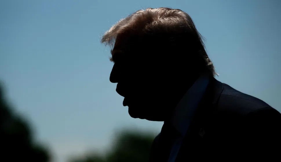 US President Donald Trump stops to speak to reporters before boarding Marine One as he departs from the South Lawn of the White House in Washington, DC, on May 1, 2026. Trump is going to Florida to speak at an event at The Villages and to attend the Forum Club of the Palm Beaches dinner. (Photo by SAUL LOEB/AFP)