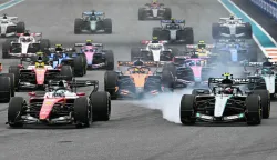 (L/R) Ferrari's Monegasque driver Charles Leclerc and Mercedes' Italian driver Kimi Antonelli race at the front of the pack at the start of the 2026 Miami Formula One Grand Prix at Miami International Autodrome in Miami Gardens, Florida, on May 3, 2026. (Photo by CHANDAN KHANNA/AFP)