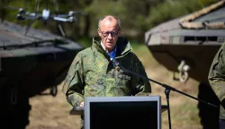 German Chancellor Friedrich Merz addresses journalists during his visit of the German army barracks in Munster, northern Germany, on April 30, 2026. (Photo by DANIEL REINHARDT/AFP)