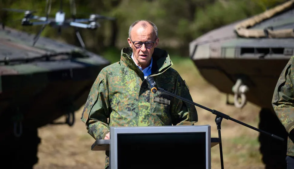 German Chancellor Friedrich Merz addresses journalists during his visit of the German army barracks in Munster, northern Germany, on April 30, 2026. (Photo by DANIEL REINHARDT/AFP)