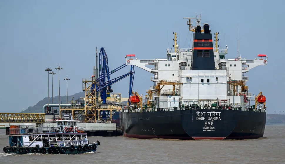 Desh Garima, an Indian-flagged tanker carrying crude oil that transited through the Strait of Hormuz, is seen docked at an offloading terminal along the coast in Mumbai on April 30, 2026. India, the world's third-largest oil buyer, normally sources about half of its crude through the Strait of Hormuz, a vital waterway that has seen only a trickle of traffic since the United States and Israel launched attacks on Iran on February 28. (Photo by Punit PARANJPE/AFP)