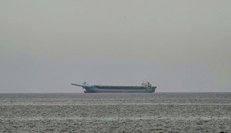 A ship is seen off the coast of Sharjah, the day after the failure of US-Iran peace talks on April 13, 2026. The failure of US-Iran peace talks has left the US President with several unpalatable options, as analysts say his order to blockade the strategic Strait of Hormuz could further complicate his next move on April 12, 2026. Any hopes that US Vice President would emerge from the marathon day of negotiations with top Iranian officials with a deal to end a war that has rippled across the Middle East were dashed when he left hosts Pakistan emptyhanded. (Photo by AFP)