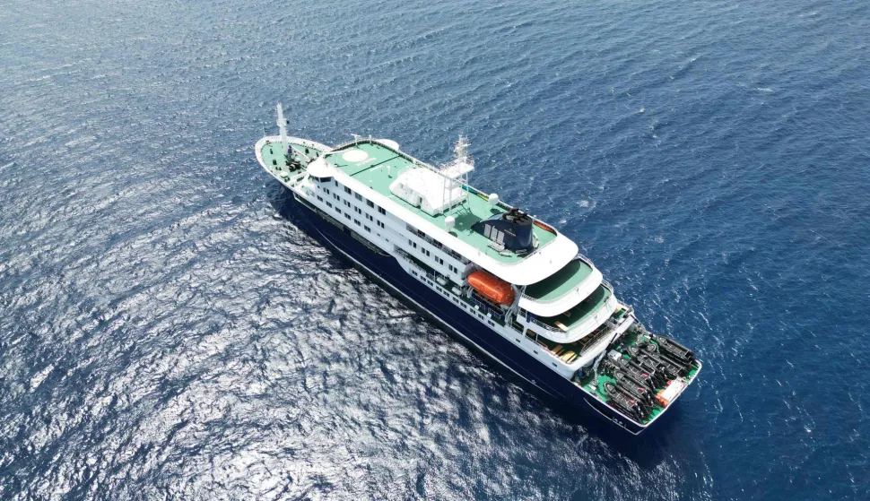 This aerial picture shows a general view of the cruise ship MV Hondius stationary off the port of Praia, the capital of Cape Verde, on May 4, 2026. Strict precautionary measures including isolation are in place on a cruise ship anchored off Cape Verde on which a suspected outbreak of hantavirus has killed three people, the cruise operator said on May 4, 2026.The Canary Islands are being "considered" for disembarkation of the boat, which has 149 people of 23 nationalities on board, after Cape Verde refused entry, Oceanwide Expeditions said in a statement. (Photo by AFP)
