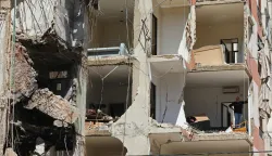 This photograph taken during a media tour organised by the Hezbollah's media office shows a resident inspecting the destructioin at his apartment in Beirut's southern suburbs on May 6, 2026. Israel and Hezbollah have been trading accusations of violating the ceasefire agreement in force since April 17. Hezbollah has claimed responsibility for several operations targeting Israeli forces in southern Lebanon, as well as attacks on northern Israel. (Photo by Anwar AMRO/AFP)