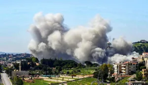 TOPSHOT - Smoke rises following Israeli bombardment on the town of Nabatieh in southern Lebanon on May 7, 2026. (Photo by Abbas Fakih/AFP)