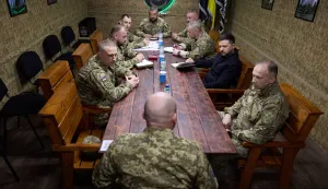 TOPSHOT - In this handout photograph taken and released by the Ukrainian Presidential Press Service on May 8, 2026, Ukraine's President Volodymyr Zelensky (2nd R) and Commander-in-Chief of the Armed Forces of Ukraine Oleksandr Syrsky (R) attend a meeting with Ukrainian servicemen at an undisclosed location in the Dnipropetrovsk region, amid the Russian invasion of Ukraine. (Photo by Handout/UKRAINIAN PRESIDENTIAL PRESS SERVICE/AFP)/RESTRICTED TO EDITORIAL USE - MANDATORY CREDIT "AFP PHOTO/UKRAINIAN PRESIDENTIAL PRESS SERVICE" - NO MARKETING NO ADVERTISING CAMPAIGNS - DISTRIBUTED AS A SERVICE TO CLIENTS