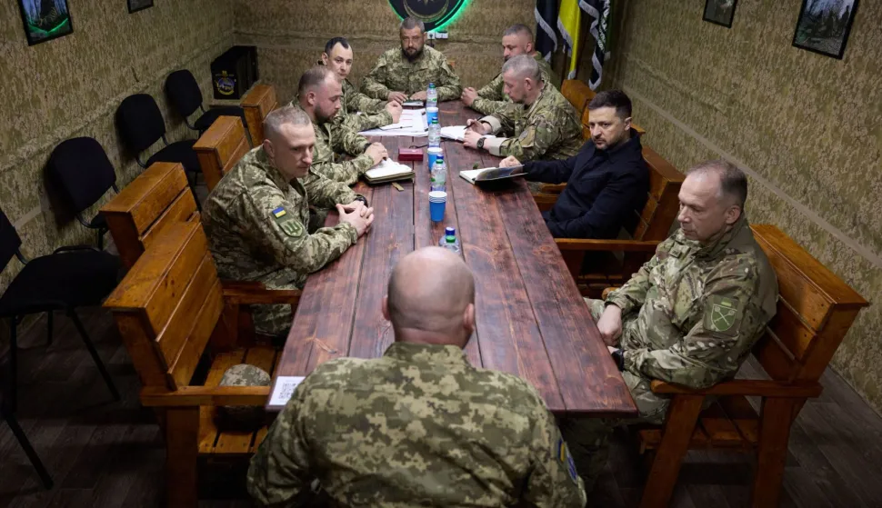 TOPSHOT - In this handout photograph taken and released by the Ukrainian Presidential Press Service on May 8, 2026, Ukraine's President Volodymyr Zelensky (2nd R) and Commander-in-Chief of the Armed Forces of Ukraine Oleksandr Syrsky (R) attend a meeting with Ukrainian servicemen at an undisclosed location in the Dnipropetrovsk region, amid the Russian invasion of Ukraine. (Photo by Handout/UKRAINIAN PRESIDENTIAL PRESS SERVICE/AFP)/RESTRICTED TO EDITORIAL USE - MANDATORY CREDIT "AFP PHOTO/UKRAINIAN PRESIDENTIAL PRESS SERVICE" - NO MARKETING NO ADVERTISING CAMPAIGNS - DISTRIBUTED AS A SERVICE TO CLIENTS