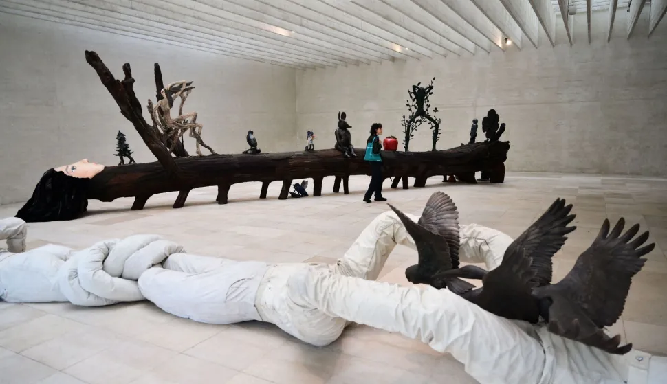 A picture shows art pieces "Lust for Life" by Swedish artist Klara Kristalova (background) and "Bird Disguise" during the pre-opening of the 61st Venice Biennale art show, on May 5, 2026 in Venice. (Photo by MARCO BERTORELLO/AFP)/RESTRICTED TO EDITORIAL USE - MANDATORY MENTION OF THE ARTIST UPON PUBLICATION - TO ILLUSTRATE THE EVENT AS SPECIFIED IN THE CAPTION
