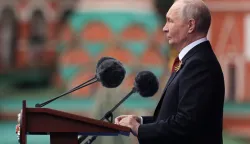 In this pool photograph distributed by the Russian state agency Sputnik, Russia's President Vladimir Putin gives a speech during the Victory Day military parade at Red Square in Moscow on May 9, 2026. Russia celebrates the 81st anniversary of the Soviet Union's victory over Nazi Germany in World War Two (WWII). (Photo by Vyacheslav PROKOFYEV/POOL/AFP)