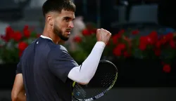 Croatia's Dino Prizmic reacts as he plays against Serbia's Novak Djokovic during their men's singles match of the WTA Rome Open tennis tournament at the Foro Italico in Rome on May 8, 2026. (Photo by Filippo MONTEFORTE/AFP)