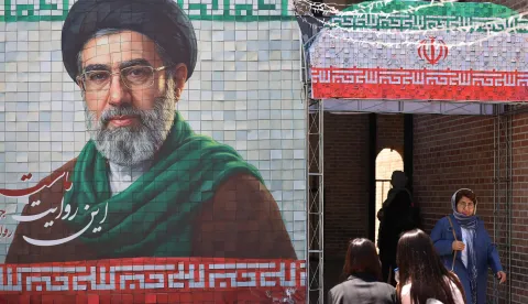 A commuter walks past a large tiled image of Iran's current leader Ayatollah Mojtaba Khamenei, at the entrance to the metro in Tehran on May 9, 2026. (Photo by ATTA KENARE/AFP)/
