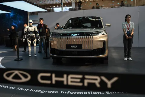Chery?s Fengyun T11 SUV is on display at the Beijing Auto Show in Beijing on April 24, 2026. Thousands squeezed into the world's biggest car show on April 24, snapping selfies beside Chinese electric vehicles as automakers showcased AI, humanoid robots and flying-car ambitions in a cut-throat market. (Photo by Jade GAO/AFP)